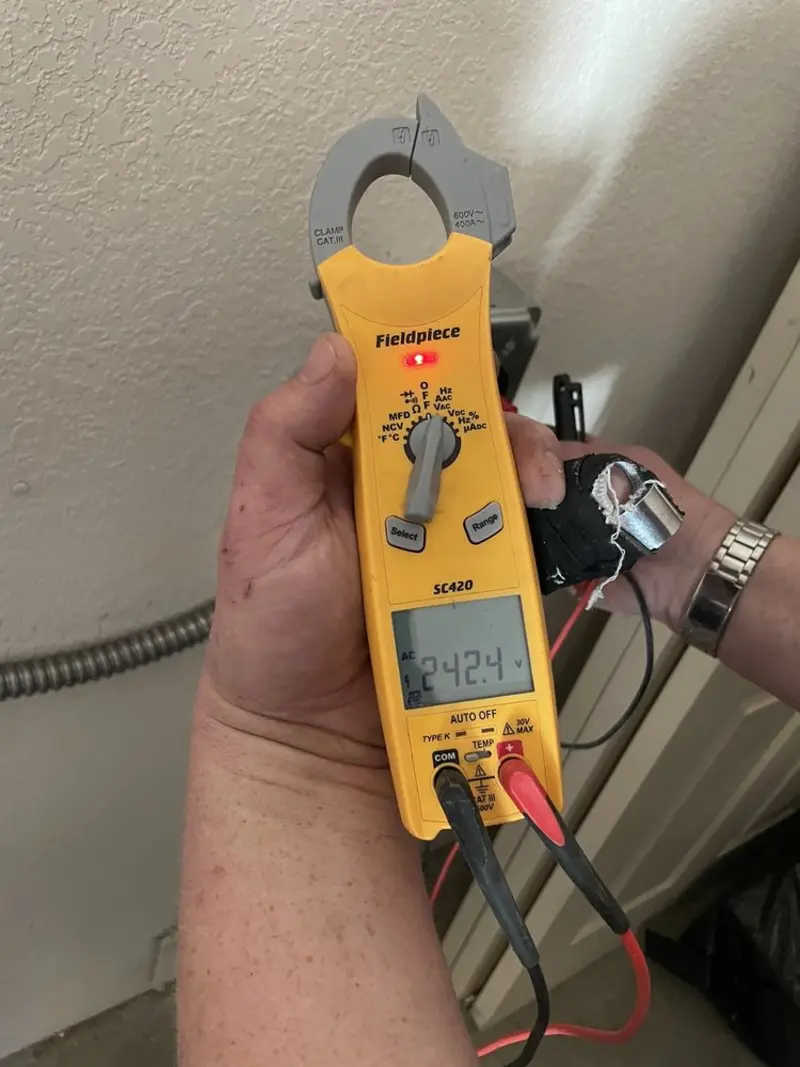 Voltage testing with clamp meter during Whole House Surge Protector in Choccolocco